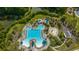 This aerial view showcases a beautiful resort-style pool with lazy river, water slide, and splash pad at 2997 Sturbridge Rd, Mount Pleasant, SC 29466