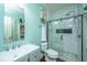Well-lit bathroom featuring modern fixtures, glass enclosed shower, white subway tile, and gray vanity sink at 2997 Sturbridge Rd, Mount Pleasant, SC 29466