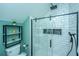Modern bathroom features a glass shower, white subway tile, and open shelving with towels and decor at 2997 Sturbridge Rd, Mount Pleasant, SC 29466