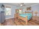 Bright bedroom featuring beautiful hardwood floors, wooden furniture, and lots of natural light from the windows at 2997 Sturbridge Rd, Mount Pleasant, SC 29466
