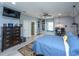 Spacious bedroom featuring light gray walls, ceiling fan, wood flooring, and en suite bathroom at 2997 Sturbridge Rd, Mount Pleasant, SC 29466