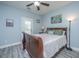 Well lit bedroom featuring hardwood floors, neutral paint, a ceiling fan and a back patio entrance at 2997 Sturbridge Rd, Mount Pleasant, SC 29466