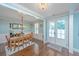 Elegant dining room with hardwood floors, a chandelier, and French doors providing natural light at 2997 Sturbridge Rd, Mount Pleasant, SC 29466