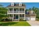 Charming two-story home boasts double porches, well-manicured lawn and a classic architectural style at 2997 Sturbridge Rd, Mount Pleasant, SC 29466
