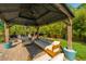 Relaxing gazebo featuring comfortable seating and a ceiling fan in a private backyard setting at 2997 Sturbridge Rd, Mount Pleasant, SC 29466