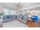 Cozy living room with plush seating, a ceiling fan, and an open view of the adjacent kitchen at 2997 Sturbridge Rd, Mount Pleasant, SC 29466