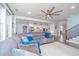 Bright living room with a large sectional sofa, ceiling fan, and open access to the kitchen at 2997 Sturbridge Rd, Mount Pleasant, SC 29466