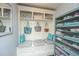 Mudroom featuring a built in bench, cabinet storage, shoe storage, and decorative pillows at 2997 Sturbridge Rd, Mount Pleasant, SC 29466