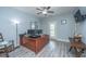 Home office featuring a ceiling fan, a large desk, 2 computer monitors, and a door to a back patio at 2997 Sturbridge Rd, Mount Pleasant, SC 29466