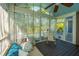 Relaxing screened porch with swing and comfortable seating overlooking the backyard at 2997 Sturbridge Rd, Mount Pleasant, SC 29466