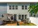 Cozy backyard deck features a dining area and grill, perfect for outdoor entertaining and relaxation at 3082 Emma Ln, Mount Pleasant, SC 29466
