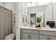 Bathroom with double sinks, gray vanity, and a view into another room at 3082 Emma Ln, Mount Pleasant, SC 29466