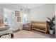 Bedroom with wooden crib, rocker, changing table, and natural lighting at 3082 Emma Ln, Mount Pleasant, SC 29466