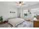 Cozy bedroom with 'NOAH' decor, giraffe, stuffed animals, and natural light at 3082 Emma Ln, Mount Pleasant, SC 29466
