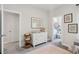 Bedroom featuring a changing table, artwork, and walk-in closet at 3082 Emma Ln, Mount Pleasant, SC 29466
