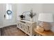 Bright foyer with decorated table, mirror, and decor with hard wood flooring at 3082 Emma Ln, Mount Pleasant, SC 29466