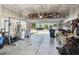 Spacious garage with ample storage, overhead racks, and an open door revealing the front of the house at 3082 Emma Ln, Mount Pleasant, SC 29466