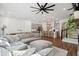 Spacious living room featuring fireplace, dining table, kitchen with island, and comfortable sectional sofa at 3082 Emma Ln, Mount Pleasant, SC 29466