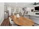 Open concept living with kitchen, dining area, staircase, fireplace, and a gray sectional sofa at 3082 Emma Ln, Mount Pleasant, SC 29466