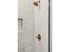 Close-up of a shower featuring marble tiling, shower head, and temperature control at 3082 Emma Ln, Mount Pleasant, SC 29466