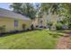 Grassy backyard showcasing ample outdoor space for entertaining at 312 Germander Ave, Summerville, SC 29483