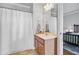 Bright bathroom with a vanity, ample counter space, and a shower, located just off the bedroom at 312 Germander Ave, Summerville, SC 29483