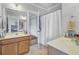 Double-sink vanity in a bathroom with a separate toilet and shower area, and connecting door at 312 Germander Ave, Summerville, SC 29483