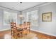Dining room with a simple light fixture and chair rail molding at 312 Germander Ave, Summerville, SC 29483