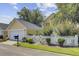 Charming home with a well-manicured lawn and white picket fence at 312 Germander Ave, Summerville, SC 29483