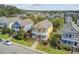Charming two-story yellow home featuring a double balcony and well-manicured landscaping in a serene neighborhood at 312 Germander Ave, Summerville, SC 29483
