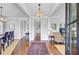 Grand foyer featuring hardwood floors, beautiful chandelier, and an open floor plan at 312 Germander Ave, Summerville, SC 29483