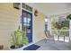 Inviting front porch with a dark door, chairs, and a small table for relaxing outdoors at 312 Germander Ave, Summerville, SC 29483