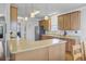 Kitchen features a breakfast bar, stainless steel appliances, and custom cabinets at 312 Germander Ave, Summerville, SC 29483
