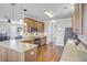 Open kitchen with breakfast bar, stainless appliances, and hardwood floors at 312 Germander Ave, Summerville, SC 29483