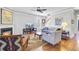 Cozy living room features fireplace, ceiling fan, and hardwood floors at 312 Germander Ave, Summerville, SC 29483