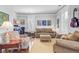 Inviting living room showcasing comfortable seating, stylish decor, and shuttered windows for privacy at 312 Germander Ave, Summerville, SC 29483