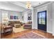 Cozy living room featuring hardwood floors, comfortable seating, and ample natural light from large windows at 312 Germander Ave, Summerville, SC 29483