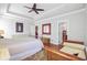 Large bedroom features a decorative rug, sitting area, tray ceiling, and ensuite bath at 312 Germander Ave, Summerville, SC 29483