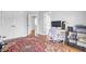 Well-lit office area features built-in storage, a modern desk setup, and hardwood floors at 312 Germander Ave, Summerville, SC 29483