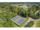 Aerial view of community tennis courts surrounded by lush greenery and located near the community swimming pool at 312 Germander Ave, Summerville, SC 29483