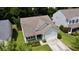 Aerial shot of a home with a driveway, landscaping, and a welcoming front porch at 3198 Conservancy Ln, Charleston, SC 29414