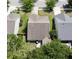 Aerial view of a home featuring a backyard with a small patio surrounded by green lawns and mature trees at 3198 Conservancy Ln, Charleston, SC 29414