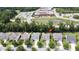 Aerial view of a charming neighborhood with tree-lined streets, adjacent to nearby schools and a pond at 3198 Conservancy Ln, Charleston, SC 29414