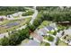 Aerial shot of a home located near pond with lush trees, providing a scenic and tranquil environment at 3198 Conservancy Ln, Charleston, SC 29414