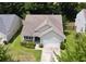 Aerial view of a home boasting a well-manicured lawn and a two-car garage, set in a peaceful neighborhood at 3198 Conservancy Ln, Charleston, SC 29414