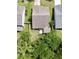 Aerial view of a home's backyard featuring a green lawn and lush trees at 3198 Conservancy Ln, Charleston, SC 29414