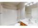 A clean bathroom offers a shower-tub combination, toilet, a wooden vanity with a sink, and a mirror at 3198 Conservancy Ln, Charleston, SC 29414