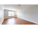A bedroom featuring a lamp, hardwood floors, and a window to let in natural light at 3198 Conservancy Ln, Charleston, SC 29414