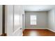 A cozy bedroom featuring hardwood floors, neutral paint, and a closet, creating a relaxing atmosphere at 3198 Conservancy Ln, Charleston, SC 29414