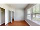 This light-filled bedroom offers hardwood floors, neutral walls, and a closet, perfect for relaxation at 3198 Conservancy Ln, Charleston, SC 29414